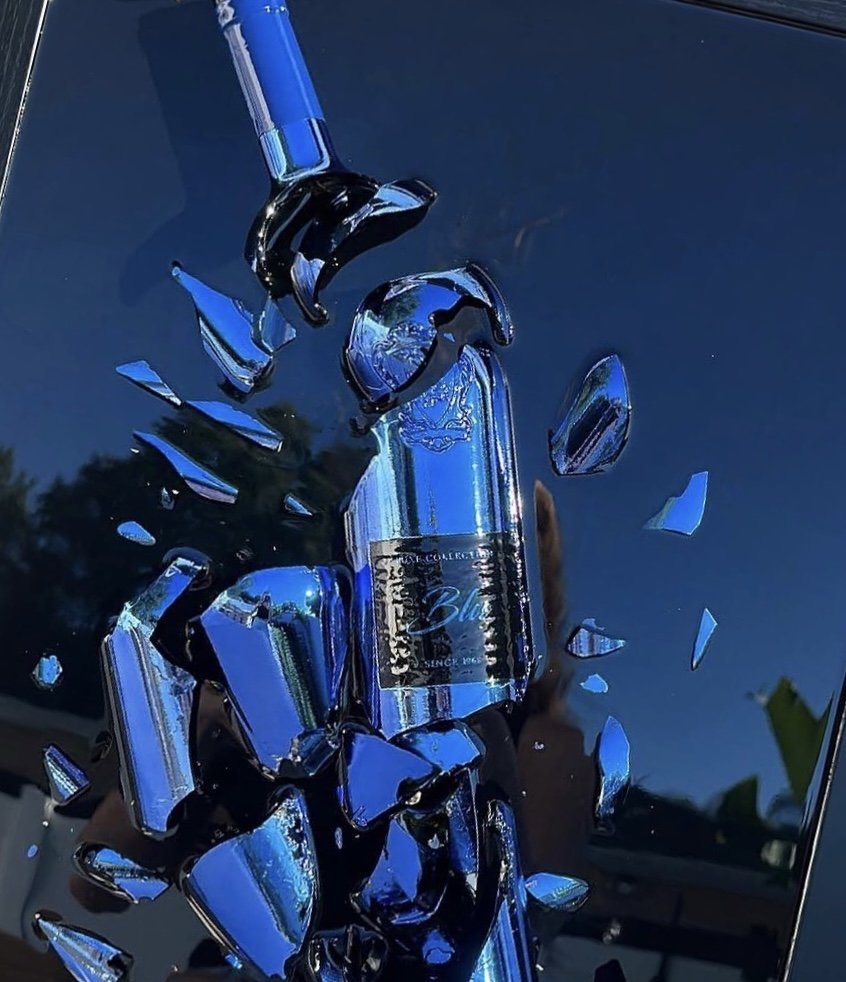 Cobalt blue bottle preserved mid-shatter