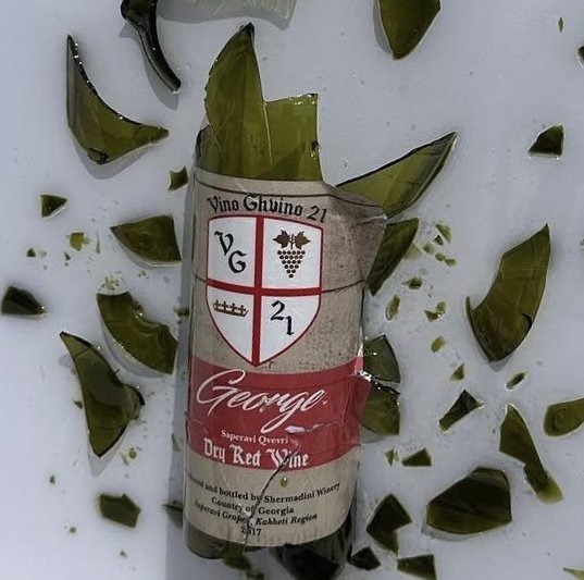 Vintage dry red wine preserved with green glass