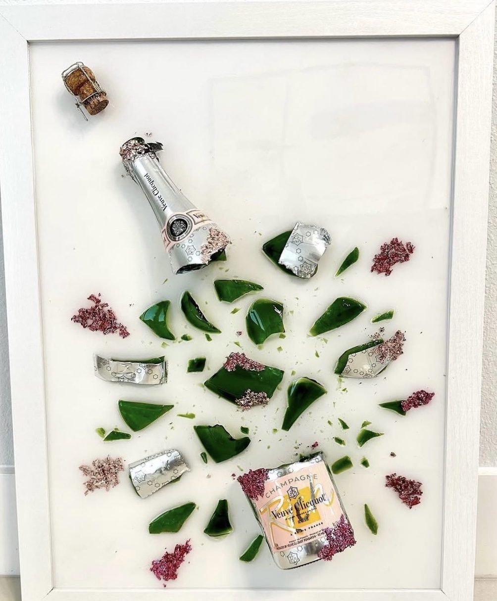 Veuve Clicquot bottle preserved by hand in green glass with floral bloom, framed as one of one wall art