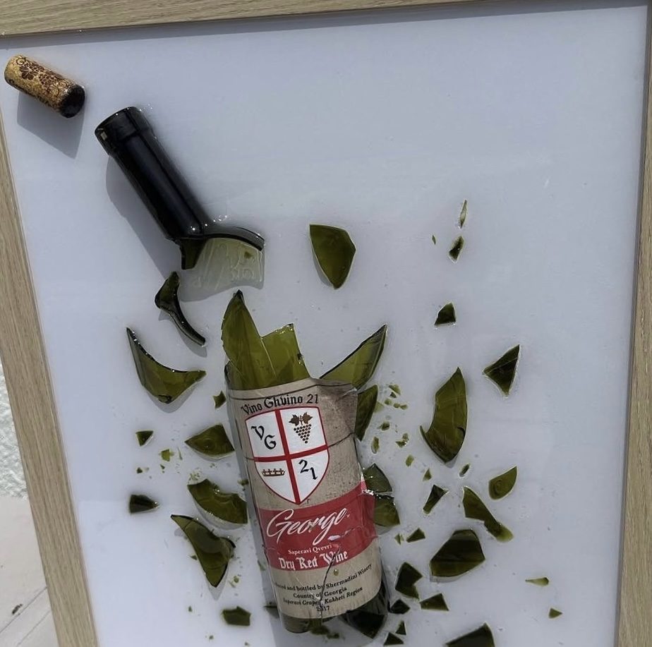 A dry red wine bottle saved from the table and preserved by hand, framed as one of one wall art